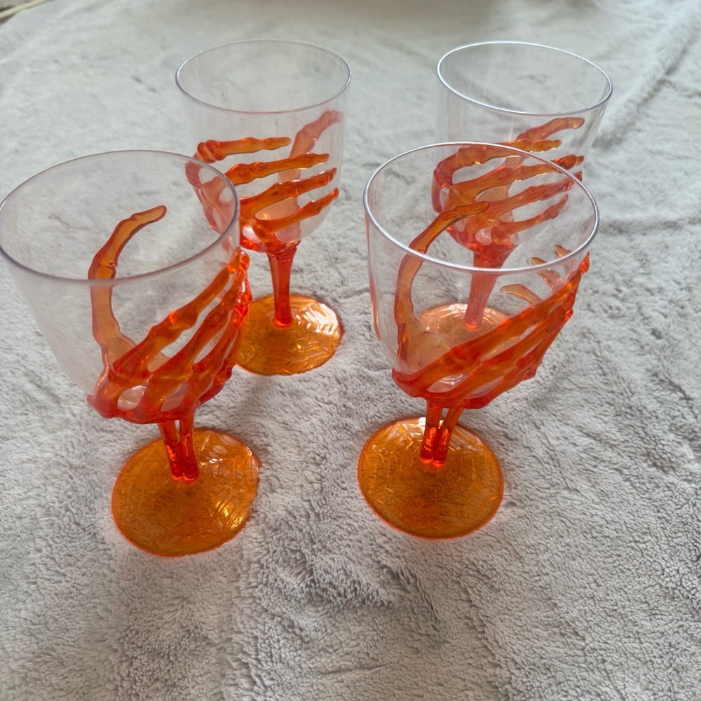 Set of 4 Halloween Skeleton Hand Goblets – Orange Plastic Cups – Spiderweb‎ Base